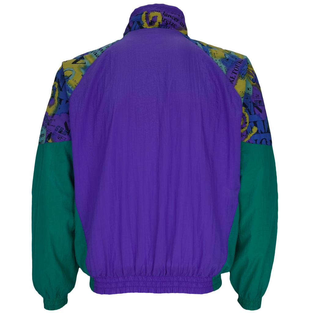 1990s vintage Reebok colorblock, zip-up windbreaker. Purple and green colorblock with multicolor pattern on yolk and 1/4 of sleeves. Medium in size and is in excellent condition.