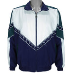 1990s vintage Puma colorblock taped logo windbreaker. Dark blue, green and white in color, fitting medium in size and in excellent condition.