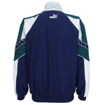 1990s vintage Puma colorblock taped logo windbreaker. Dark blue, green and white in color, fitting medium in size and in excellent condition.