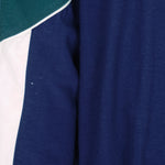 1990s vintage Puma colorblock taped logo windbreaker. Dark blue, green and white in color, fitting medium in size and in excellent condition.