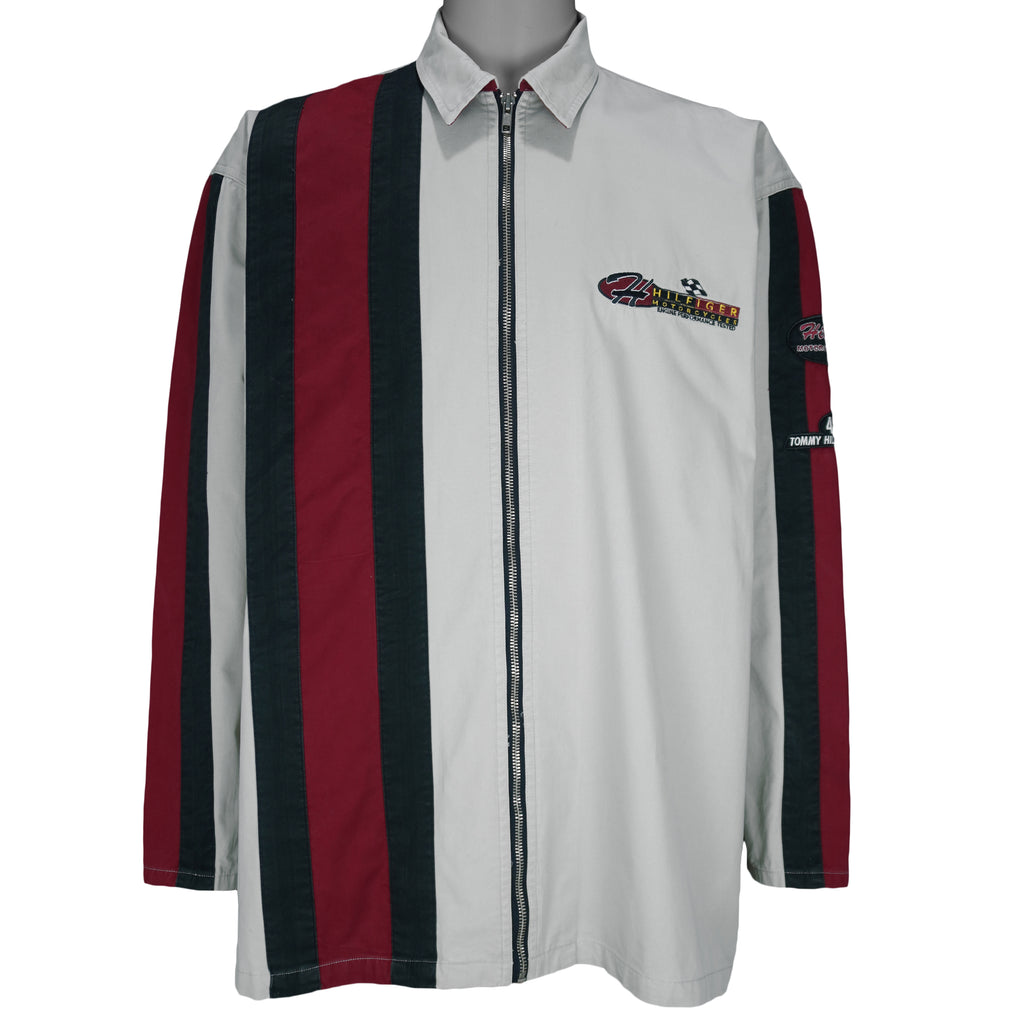 1990s vintage Tommy Hilfiger Racing work jacket. Beige in color with red and black stripes down right side and sleeves. Embroidered Hilfiger Motorcycles logo on front, back and left sleeve, Medium in size and in excellent condition.