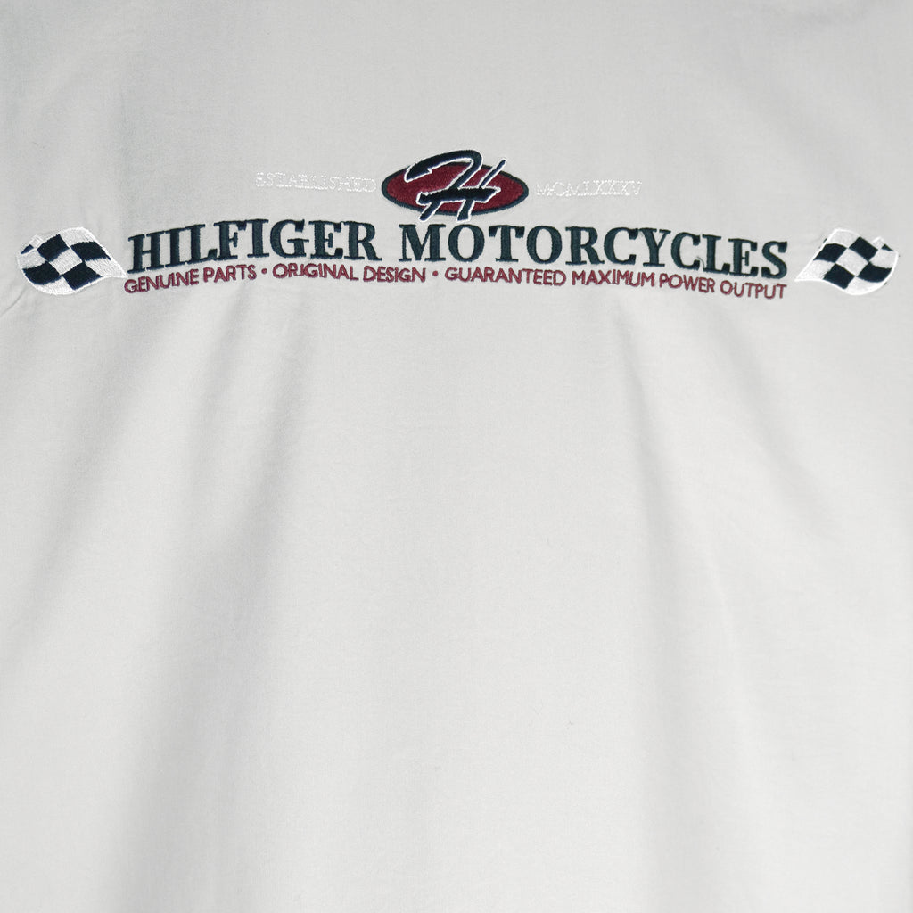 1990s vintage Tommy Hilfiger Racing work jacket. Beige in color with red and black stripes down right side and sleeves. Embroidered Hilfiger Motorcycles logo on front, back and left sleeve, Medium in size and in excellent condition.