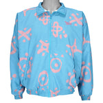 1990s vintage Reebok graffiti-patterned windbreaker. Baby blue in color with pink designs. Fitting Medium in size and in excellent condition.