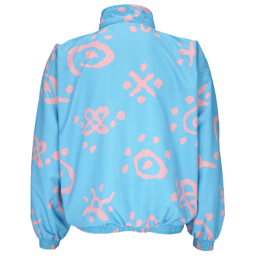 1990s vintage Reebok graffiti-patterned windbreaker. Baby blue in color with pink designs. Fitting Medium in size and in excellent condition.