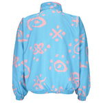 1990s vintage Reebok graffiti-patterned windbreaker. Baby blue in color with pink designs. Fitting Medium in size and in excellent condition.