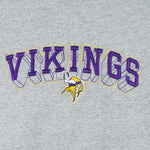 1990s vintage NFL Minnesota Vikings embroidered spell-out T-Shirt. Grey in color, fits XX-Large in size and is in excellent condition.