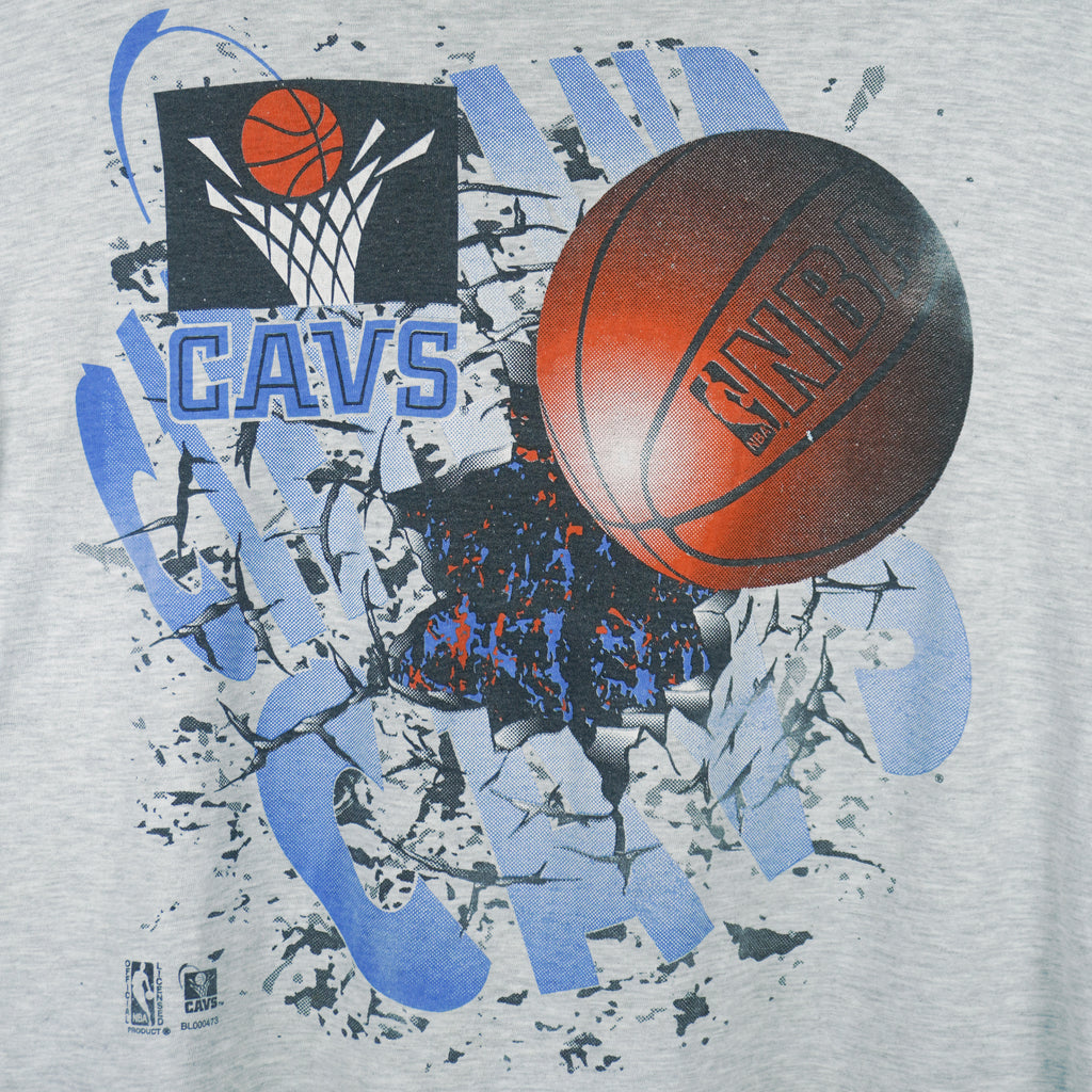 1990s vintage NBA Cleveland Cavaliers breakout-style T-Shirt by 20-20. Grey in color with spell-out and NBA basket ball on front, X-Large in size and in excellent condition.