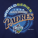 1998 vintage MLB San Diego Padres World Series print on Delta T-Shirt. Blue in color with big spell-out and baseball graphic by Majestic, Large in size and is in excellent condition.