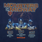 1990s Vintage NFL Chicago Bears Monsters of the Midway spell-out T-Shirt by Lee Sport. Dark blue in color with player images on front: Anthony Thomas, Brian Urlacher and Mike Brown, XX-Large in size and in excellent condition.