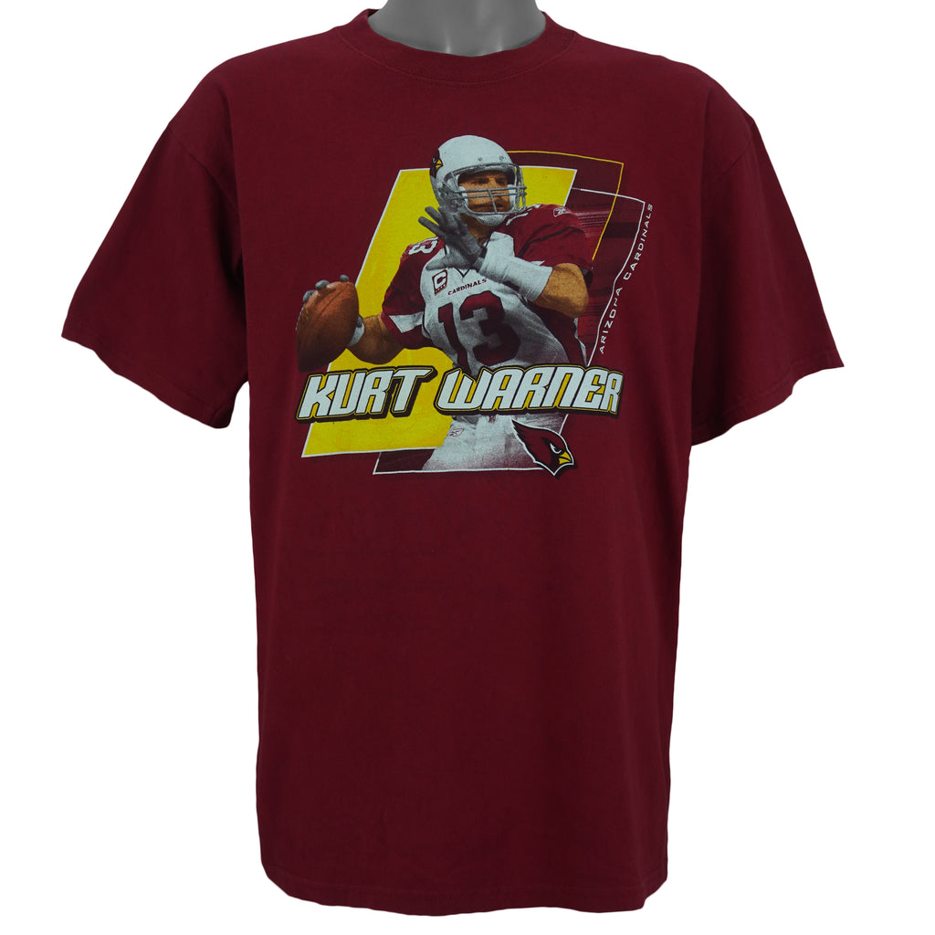 2000s vintage NFL Arizona Cardinals spell-out Kurt Warner T-Shirt by NFL Team Apparel. Red in color with player image on front, Large in size and is in excellent condition.