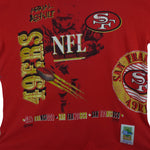 1990s vintage NFL San Francisco 49ers Aerial Assault all over print T-Shirt by Salem Sportswear. Red in color with spell-out and big logos, Salem patch on lower left front, is X-Large in size and is in excellent condition.