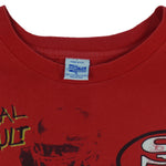 1990s vintage NFL San Francisco 49ers Aerial Assault all over print T-Shirt by Salem Sportswear. Red in color with spell-out and big logos, Salem patch on lower left front, is X-Large in size and is in excellent condition.