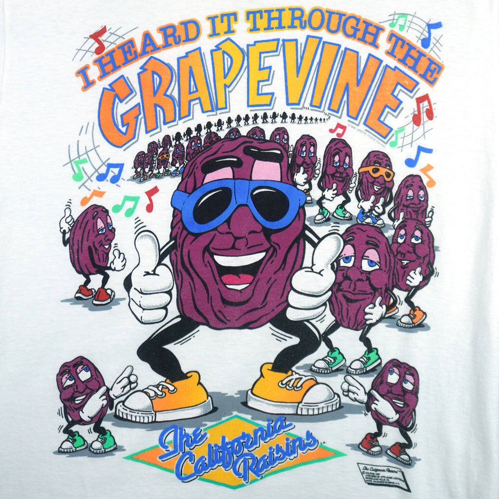 1987 vintage The California Raisins "I Heard it Through the Grapevine" T-Shirt by Anvil. White in color with dancing raisins and song lyric on front, fits small in size and is in excellent condition.