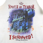 Vintage Walt Disney World "I Survived!" The Twilight Zone Tower of Terror sleeveless shirt. White in color with big printed graphic of The Hollywood Tower Hotel, tagged size X-Large, and is in good condition.