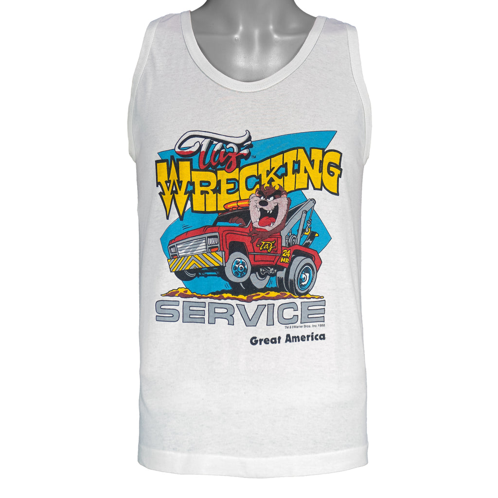 1988 vintage Looney Tunes Taz's Wrecking Service sleeveless shirt by Tee Jays. White in color with big printed graphic of the Tazmanian Devil in a tow truck, tagged size Medium, and is in excellent condition.