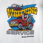 1988 vintage Looney Tunes Taz's Wrecking Service sleeveless shirt by Tee Jays. White in color with big printed graphic of the Tazmanian Devil in a tow truck, tagged size Medium, and is in excellent condition.