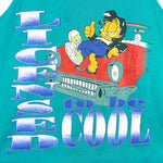 1990s vintage Garfield Licensed to Be Cool tank top. Teal in color with Garfield dressed like Elvis, tagged size Large and is in excellent condition.