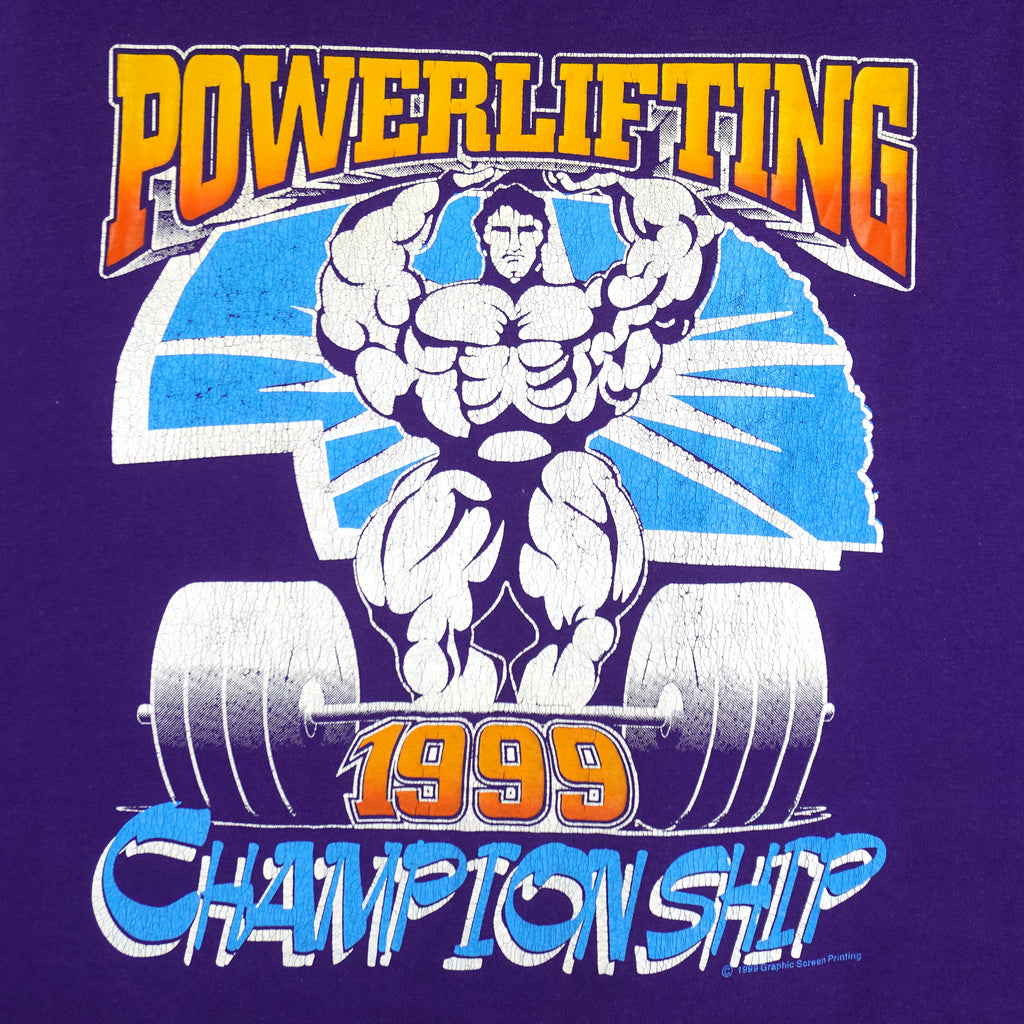 1999 vintage Powerlifting Championship sleeveless shirt by Graphic Screen Printing. Purple in color with large printed graphic on front, tagged size Medium, and is in excellent condition.